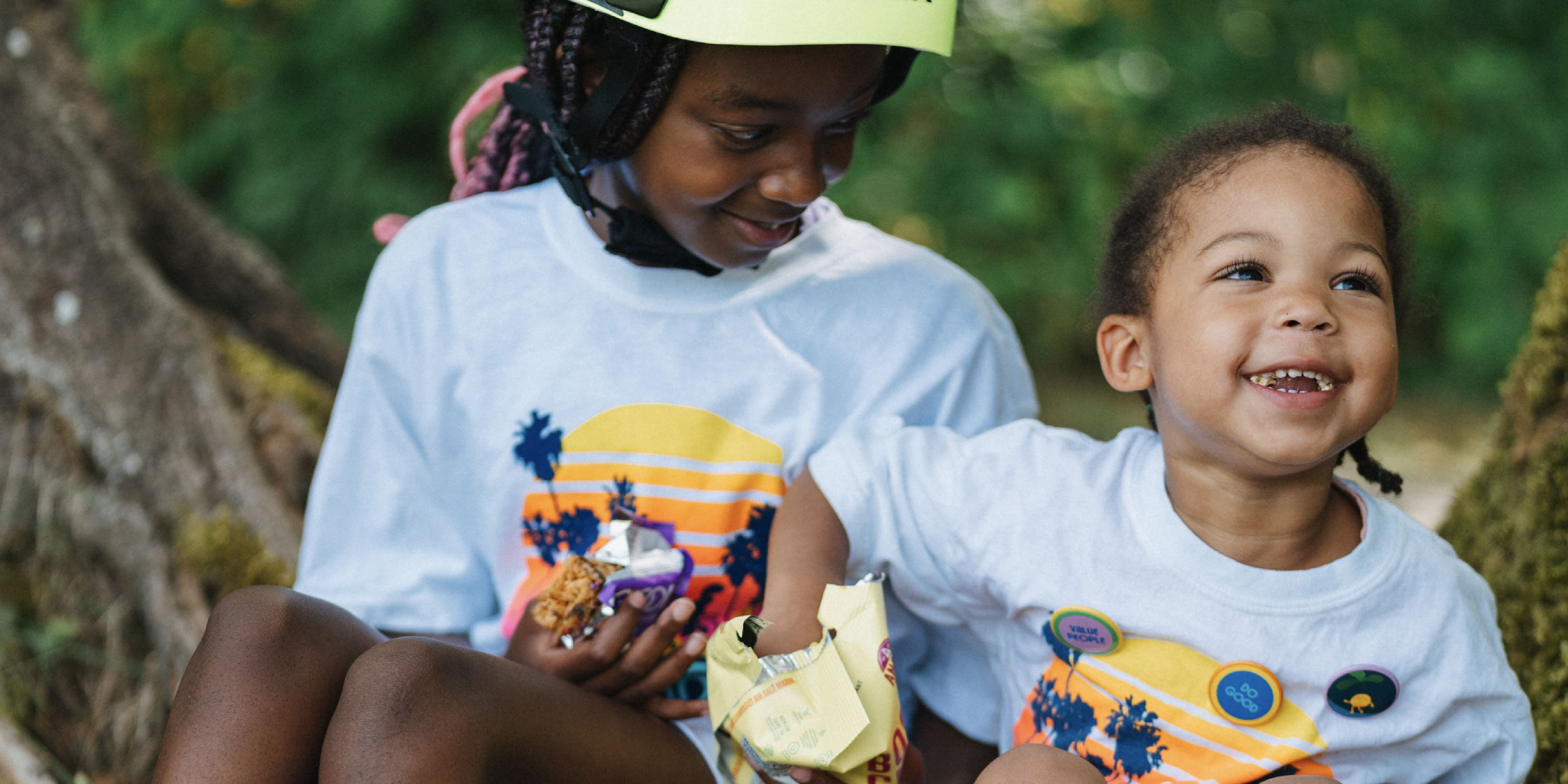 two-young-girls-eating-popcorn-and-smiling